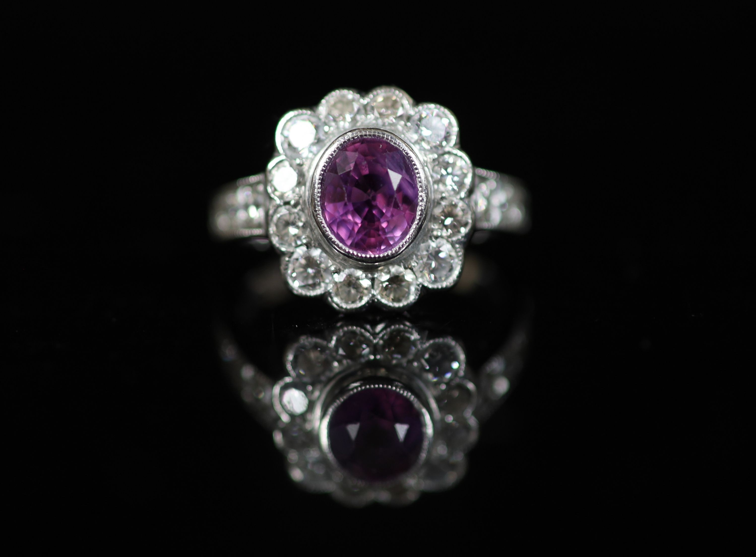 A modern 18ct white gold, pink sapphire and diamond cluster ring
